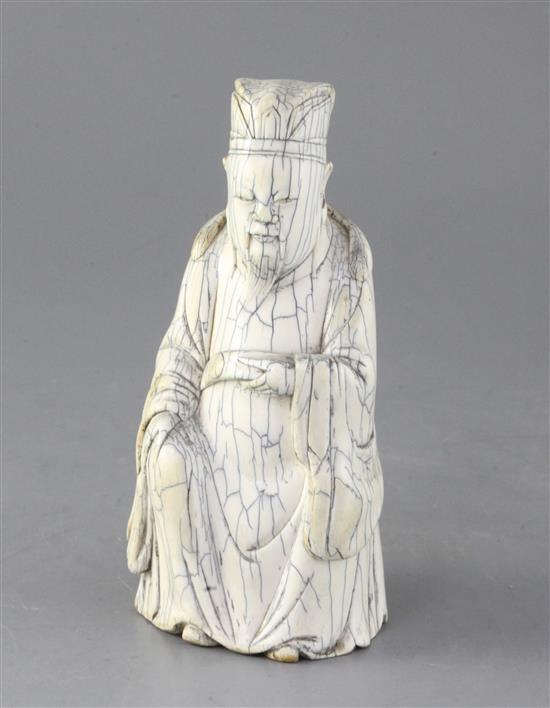 A Chinese ivory figure of an immortal, possibly Guandi, early 20th century, in Ming style, height 17cm